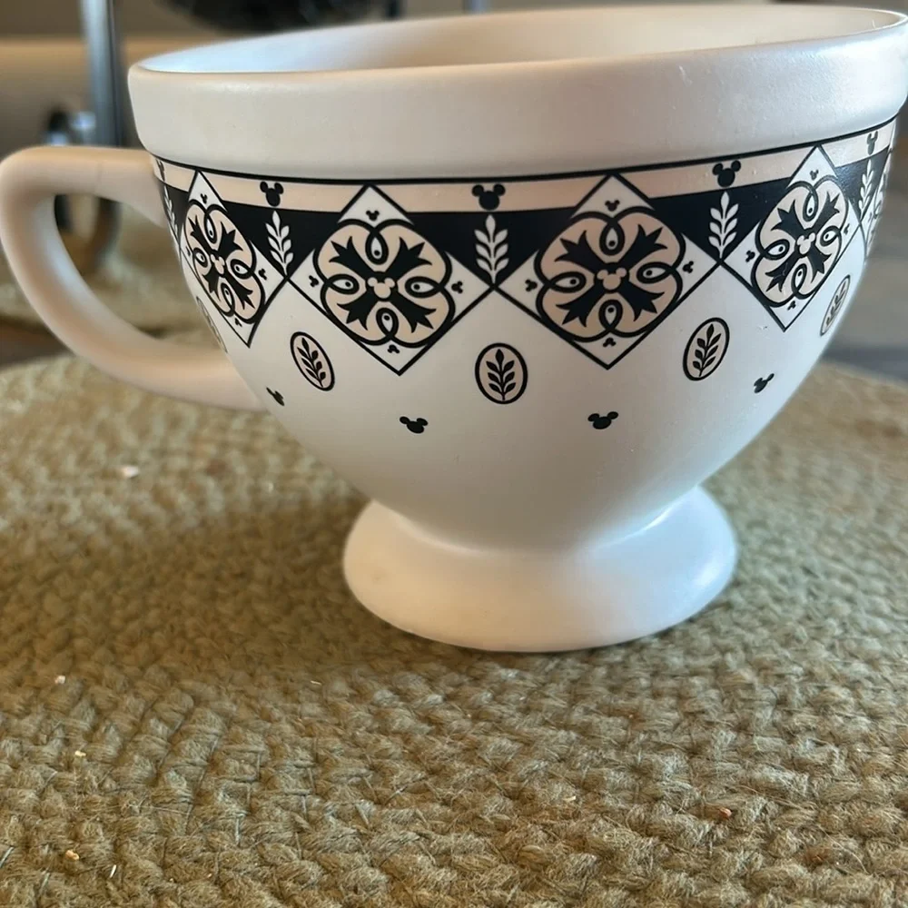 Disney cup or small soup bowl. White with black designs.